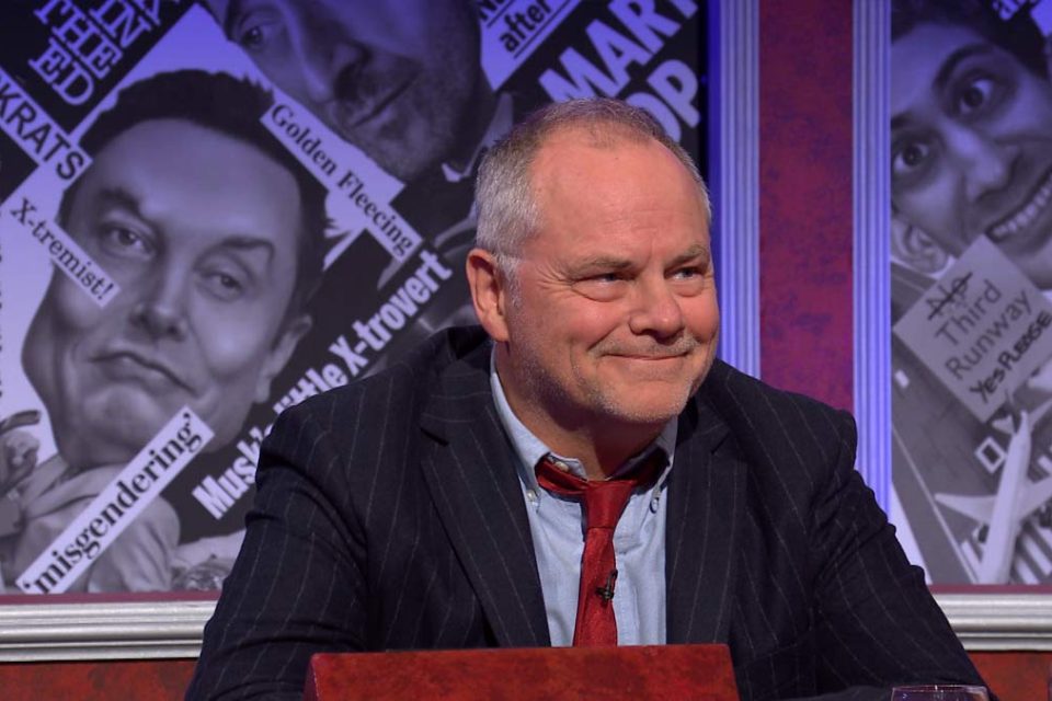 Jack, smiling, on the set of HIGNFY